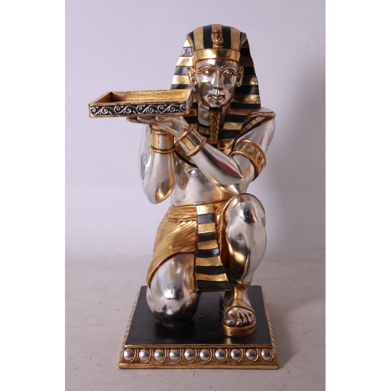 Tut à genoux avec plateau