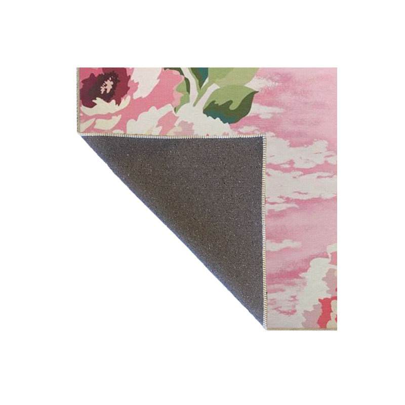 Tapis floral lavable à base tissée rose