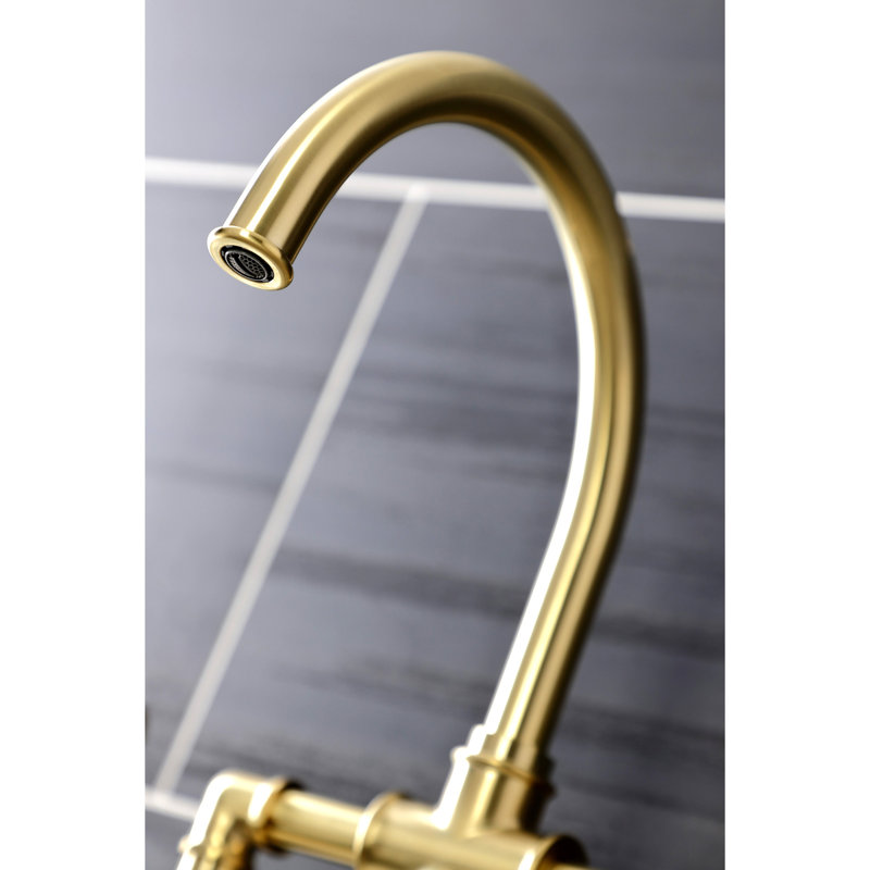 Kingston Brass Two-Handle 4-Hole Deck Mount Industrial Style Bridge Kitchen Faucet with Brass Side Sprayer, Brushed Brass