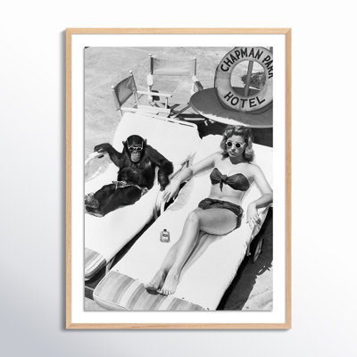 Woman Sunbathing With Chimpanzee by Getty Images