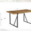 Ensemble de table et de chaises. Table de salle à manger moderne et minimaliste en bois aggloméré texturé avec structure en métal. Jumelé avec des chaises avec des coussins en suède doux et des pieds en métal noir.-796075832-796075835-796075838