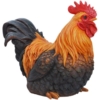 Figurine de coq accroupie