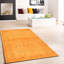 Nogosek Area Rug in Gold