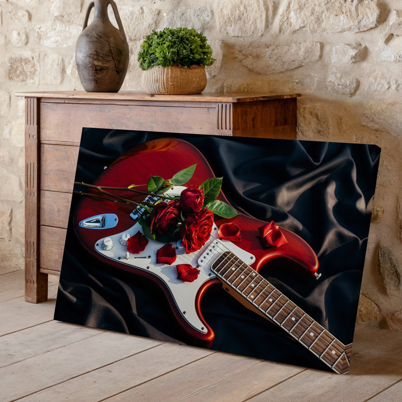 Toile, composition rapprochée avec une guitare électrique rouge éclatante posée sur un fond en tissu soyeux foncé