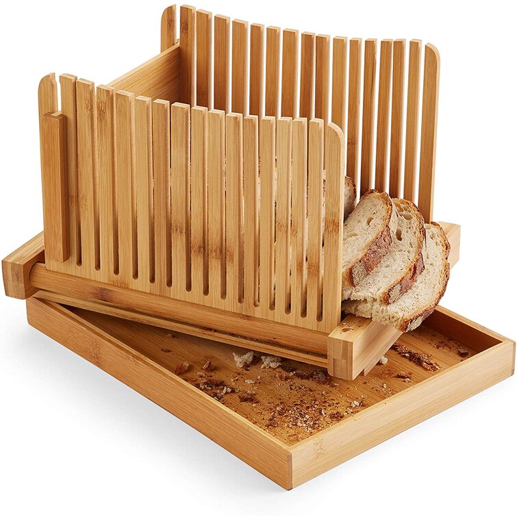 https://assets.wfcdn.com/im/24608417/resize-h755-w755%5Ecompr-r85/1683/168377091/Bread+Slicer+Guide+For+Homemade+Bread+And+Loaf+Cakes+By+Kozy+Kitchen%2C+100%25+Organic+Bamboo+Bread+Slicing+Guide%2C+Compact+Foldable+Bread+Cutter+Guide%2C+Enhanced+Bamboo+Wooden+Bagel+Slicer.jpg
