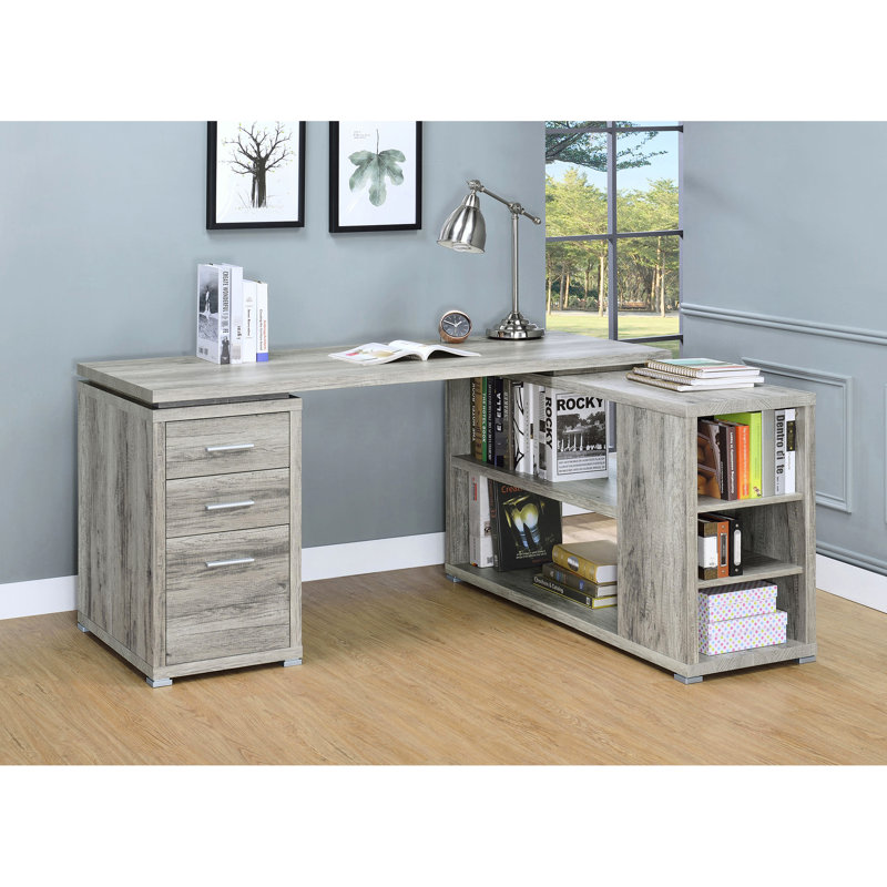 Bureau d'ordinateur en L gris effet bois flotté, 3 compartiments, au charme côtier, avec des espaces de rangement bien organisés et un aspect bois naturel. Cinq étagères.