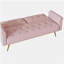 Un canapé-lit de 69,7 pouces de long recouvert de velours rose, doté d'une garniture cloutée et d'un coussin décoratif assorti