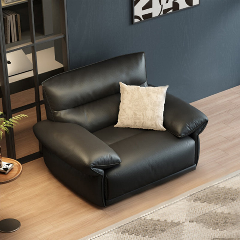 Fauteuil noir avec coussin en cuir véritable