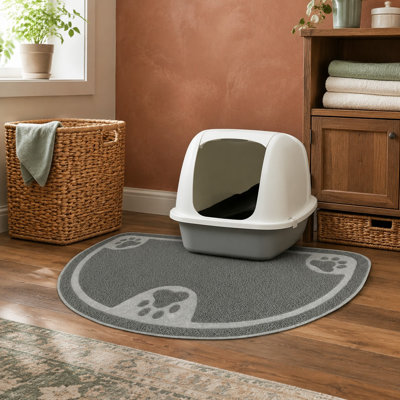 This small gray litter trap mat is soft and absorbent while capturing litter and mess; it is waterproof, non-slip, washable, protects floors from urine and moisture, stays in place, and is machine washable.