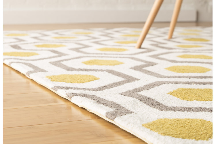 closeup of a gray and yellow area rug