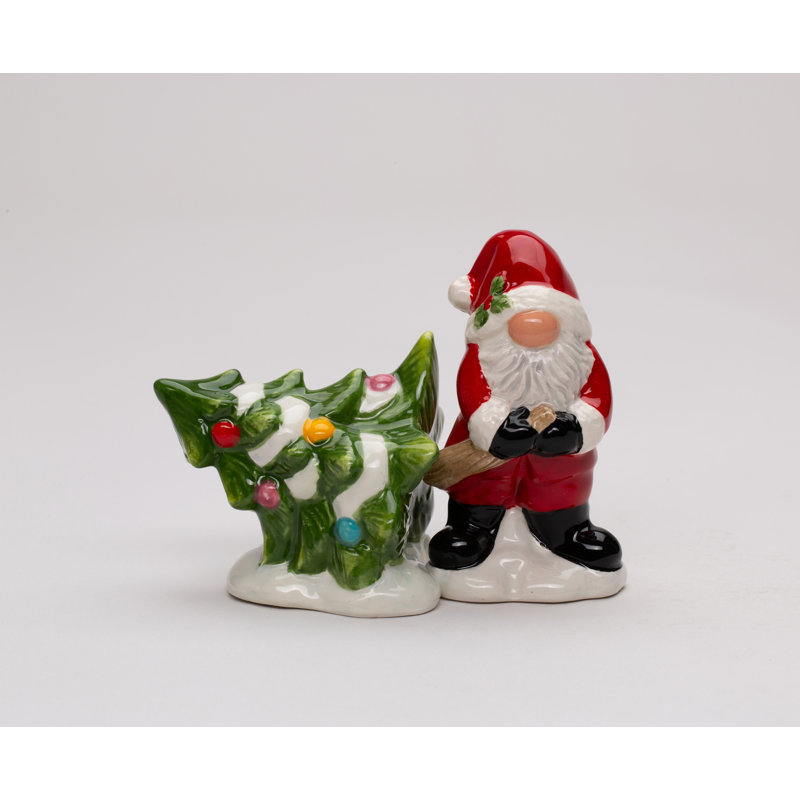 Père Noël gnome tirant du sel et du poivre