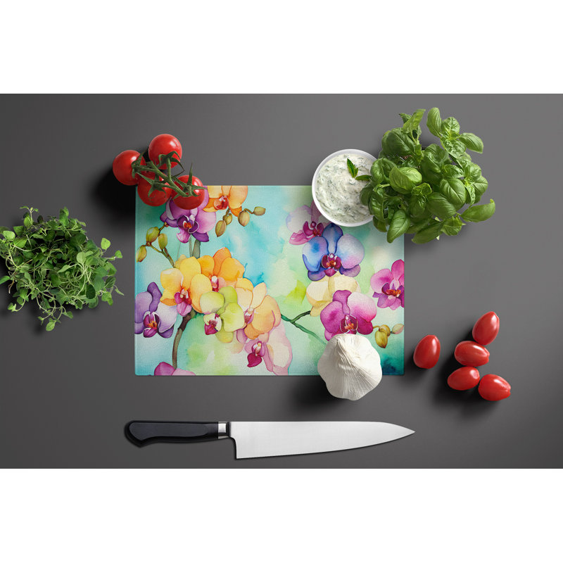 Orchidées dans une grande planche à découper en verre aquarelle