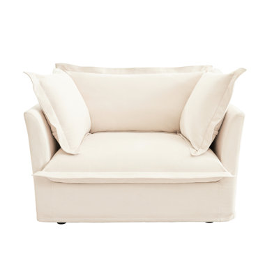 Fauteuil avec assise profonde. Chenille crème, coussins décoratifs. Siège en chenille. Luxe et confort