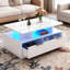 Table basse à DEL, table centrale moderne à 2 niveaux avec lumières changeantes et télécommande réglables, 4 tiroirs de rangement, tablette ouverte