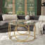 Table basse ronde avec plateau en verre et cadre circulaire en métal doré