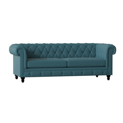Canapé Chesterfield à accoudoirs roulés