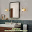 Applique murale 1 lumière pour salle de bain en laiton brossé mat avec abat-jour en cristal-150776694