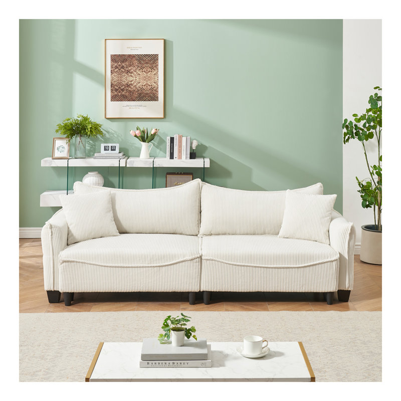 Canapé fabriqué en velours côtelé qui se transforme sans effort en canapé-lit avec deux coussins décoratifs: idéal pour les salons et les espaces multiples