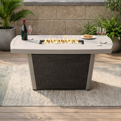 Baecher 24.61" H x 51.97" W Aluminum Outdoor Fire Pit Table with Wicker Base and Hidden Fuel Tank Storage