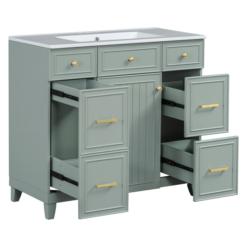 Meuble-lavabo vert avec lavabo en céramique, structure en bois massif, portes à fermeture douce et rangement réglable