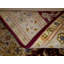 Necdet Oriental Area Rug in Burgundy