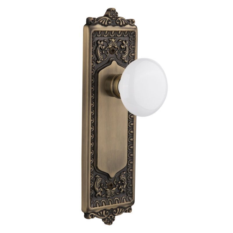 Egg & Dart Plate with White Porcelain Door Knob, Antique Brass, 2.375"