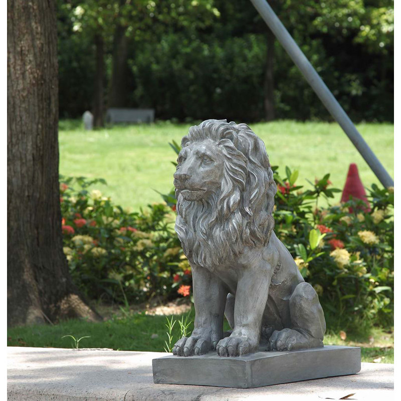 Statue de lion assis