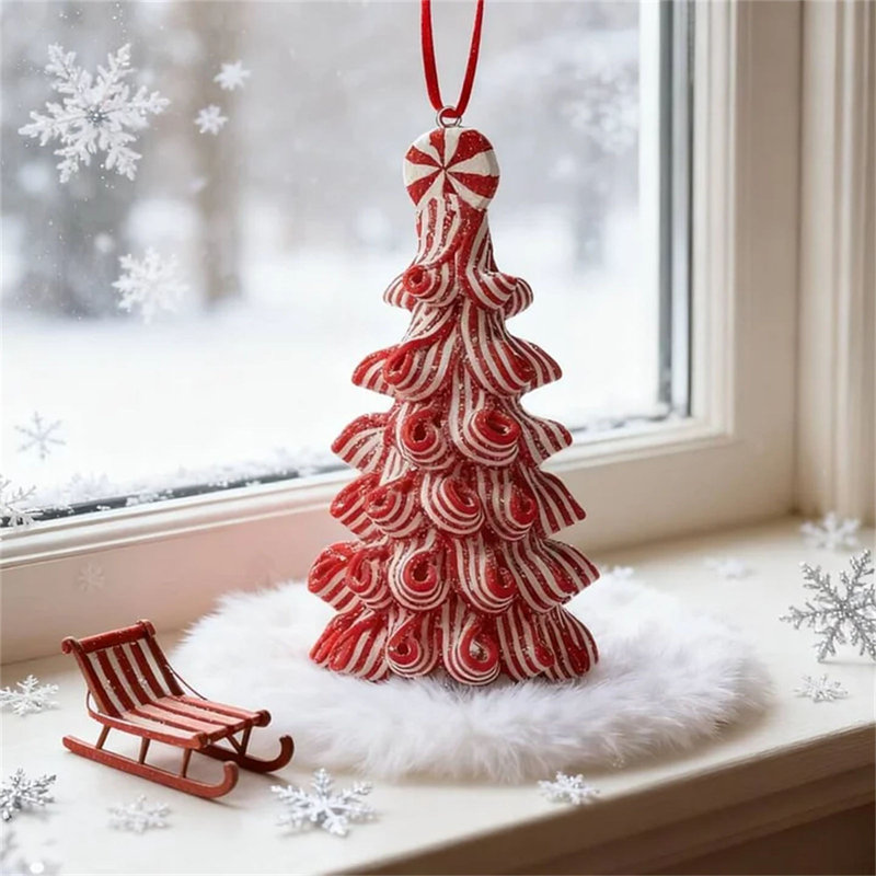 La finition brillante des arbres de Noël en polymère ajoute un lustre sophistiqué ressemblant à des bonbons qui scintille sous les lumières des Fêtes.