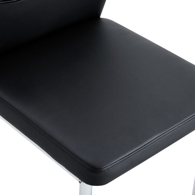 Mai de 4 chaises de salle à manger en polyuréthane noir à haute résilience avec pieds en métal argenté, conception à rayures verticales, bonne capacité de soulagement de la fatigue