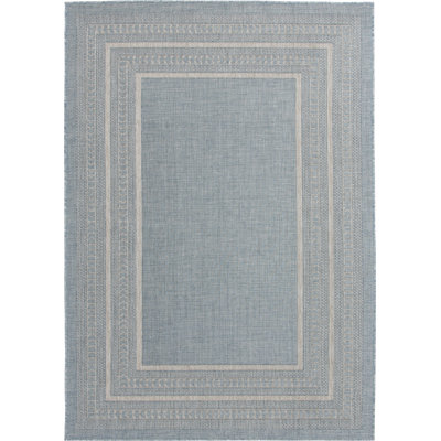 Tapis intérieur / extérieur en polypropylène à bordure bleu clair Bay Isle Home ™ Ceridwyn Sutton