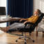Fauteuil de bureau avec hauteur réglable et repose-pieds, fauteuil de jeu inclinable à dossier haut, cuir noir, roulettes, inclinaison à 135°, base en métal et bois, rembourrage en mousse à mémoire de forme, montage facile pour un confort optimal
