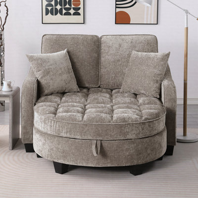 Canapé deux places, méridienne double avec accoudoirs et dossiers irréguliers, repose-pieds avec espace de rangement, deux petits coussins décoratifs