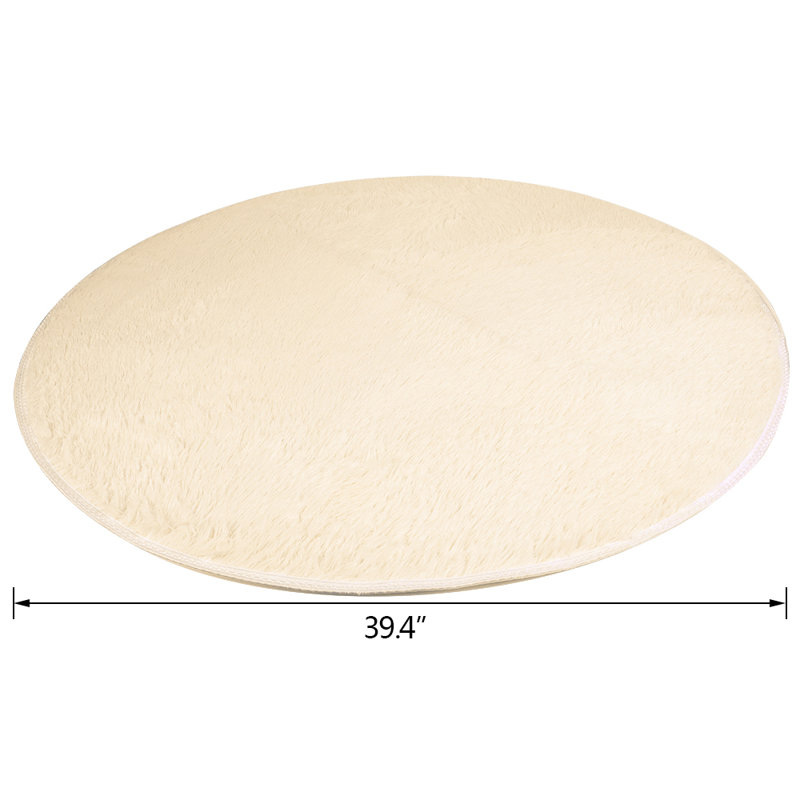 Tapis rond en coton crème à poils longs Gralf