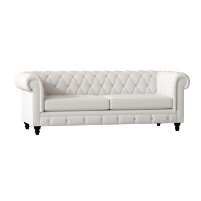 Canapé Chesterfield à accoudoirs roulés