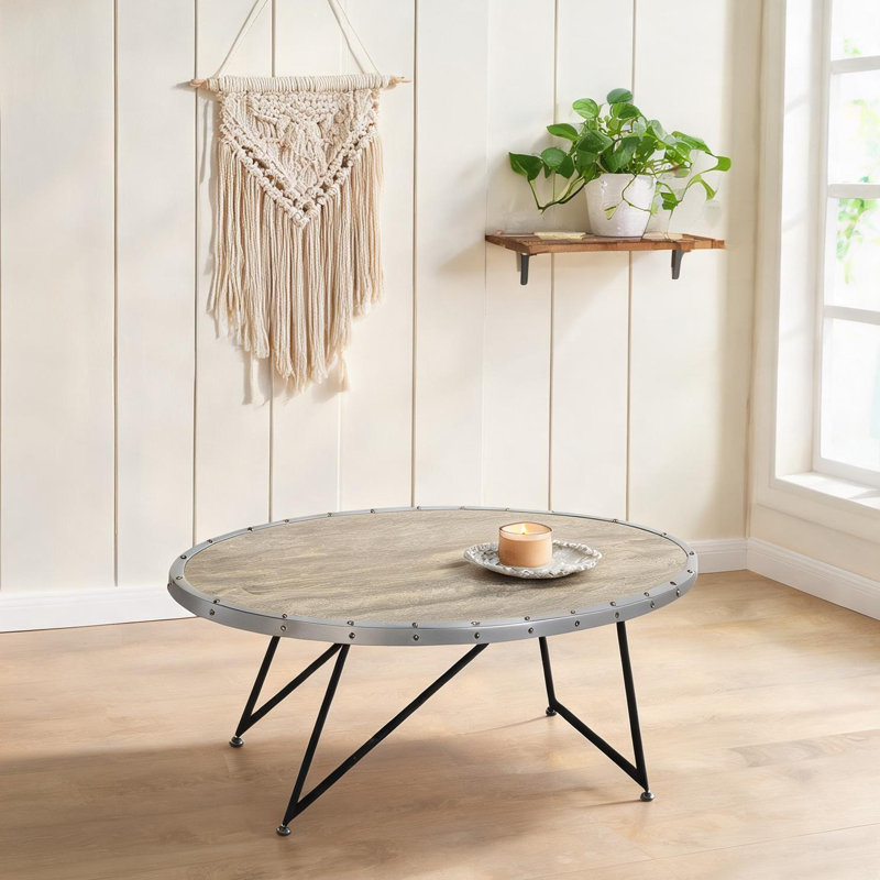 Table basse industrielle ovale avec base en métal asymétrique en gris doux et noir