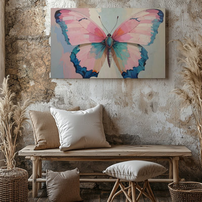 Un papillon aux couleurs vives avec des ailes de toile rose pastel soulignées dans des accents audacieux de sarcelle et d'art mural de qualité supérieure prêt à accrocher
