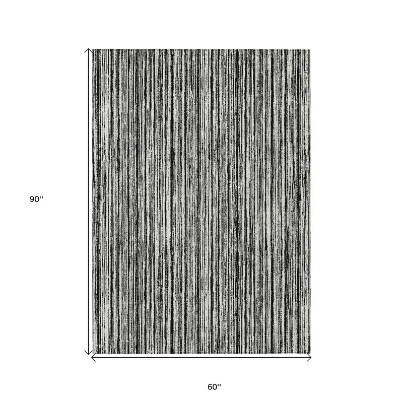Tapis extérieur lavable rayé noir et ivoire 5 pi x 8 pi