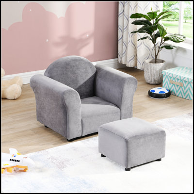 Canapé rembourré durable avec repose-pieds pour enfants, parfait pour les salles de jeux et les chambres à coucher, conçu pour durer et confortable pour les enfants.