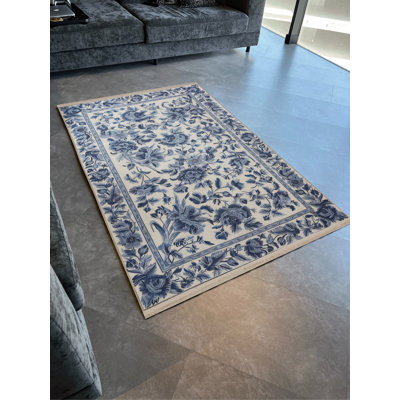 Tapis décoratif moderne à motif floral foncé et à franges bleu foncé