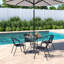 Mclin 4 - Person Patio Dining Set Umbrella Hole Included Round Table with Cushions Included