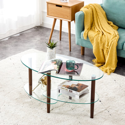 Table basse ovale avec plateau et tablette en verre, pieds en bois de chêne