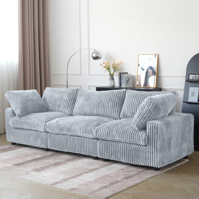 Canapé modulaire rembourré à accoudoirs larges
