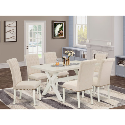 Ensemble de salle à manger 7 pièces comprenant une magnifique petite table avec plateau blanc lin et 6 superbes chaises de salle à manger ornées de clous décoratifs et de boutons capitonnés, finition blanc lin.