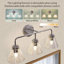 Luminaire de meuble-lavabo moderne avec abat-jour en verre transparent-471192553-321541586