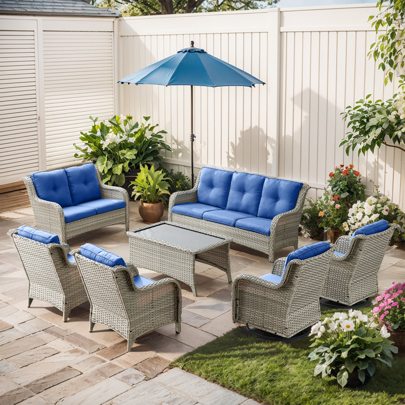 Schutt 9 - Person Wicker Outdoor Seating Group with Cushions and Coffee Table, Navy Blue