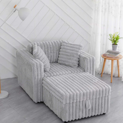 Fauteuil en fausse fourrure avec repose-pieds