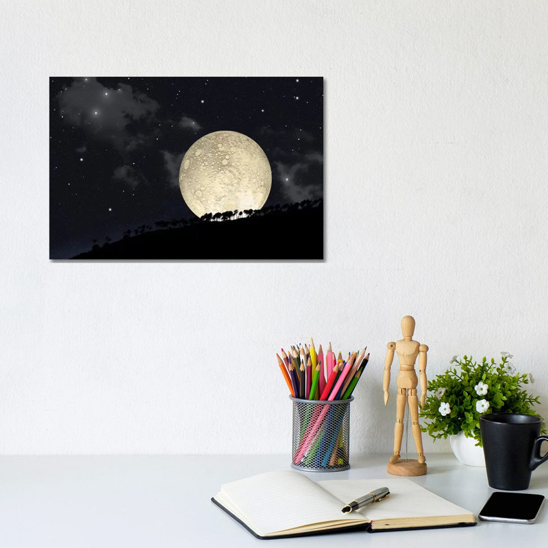 A Full Moon Rising Behind A Row Of Hilltop Trees by Marc Ward - Wrapped Canvas Print, 20.32 cm H x 30.48 cm W