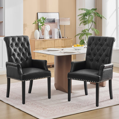 Chaise de salle à manger Amdad capitonnée en tissu avec pieds massifs