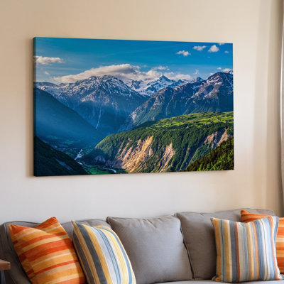Canvas A Breathtaking Panoramic View Of Majestic Snow Capped Mountains Under Wall Art A Brilliant Blue Sky Dotted With Fluffy White Canvas Wall Art
