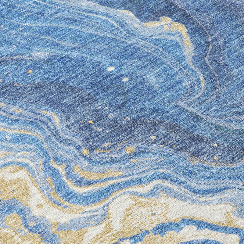 Tapis extérieur rond lavable abstrait bleu doré et ivoire Everette